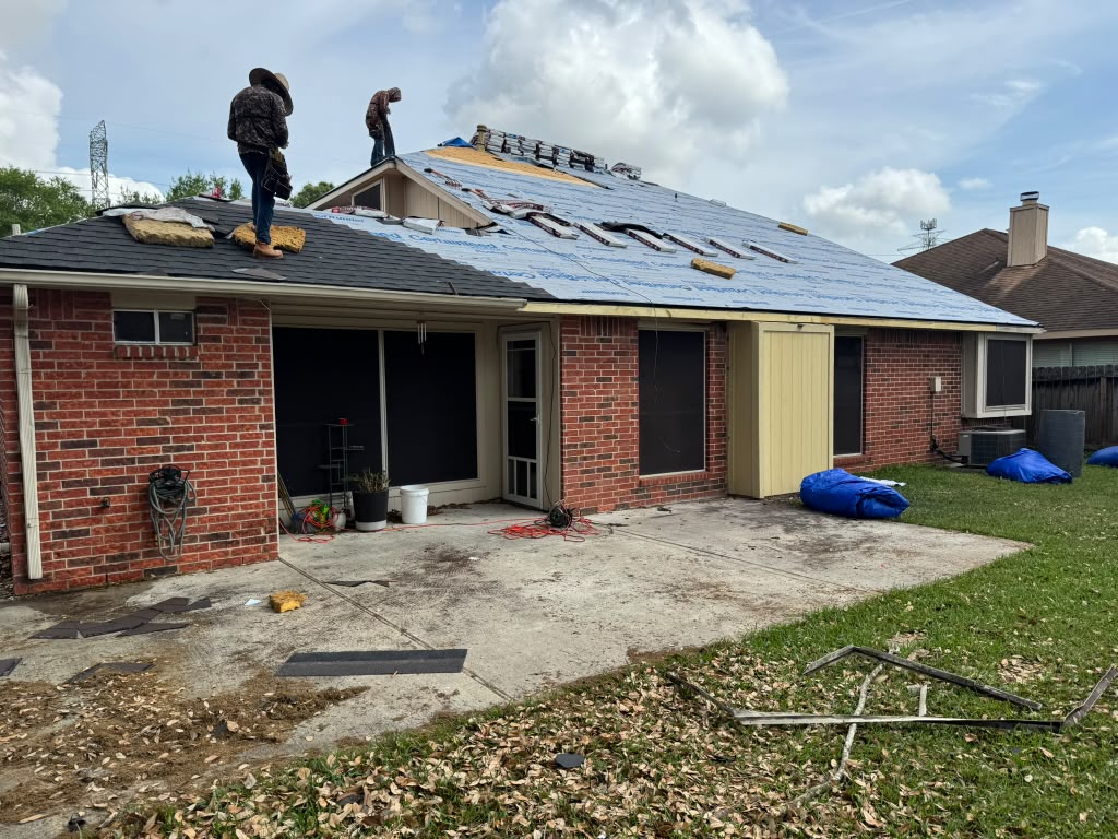 Roof tear-off and shingle installation on a Houston-area home