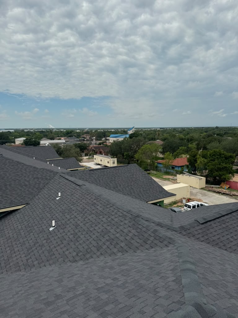Aerial view of apartment complex roofing installation