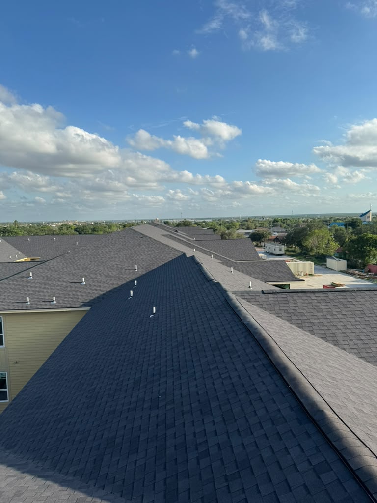 Aerial view of apartment complex roofing installation