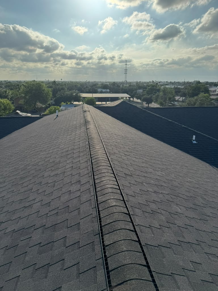 Ridge cap detail on apartment complex roof installation