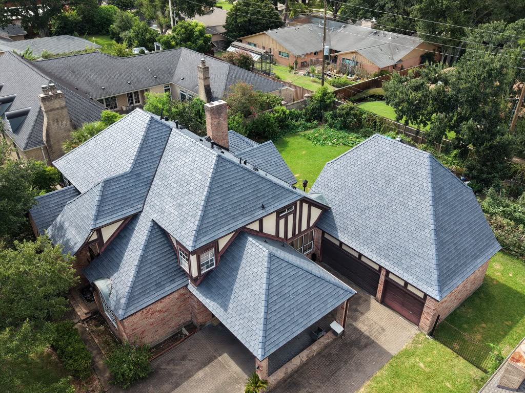Completed residential roof replacement, aerial front view