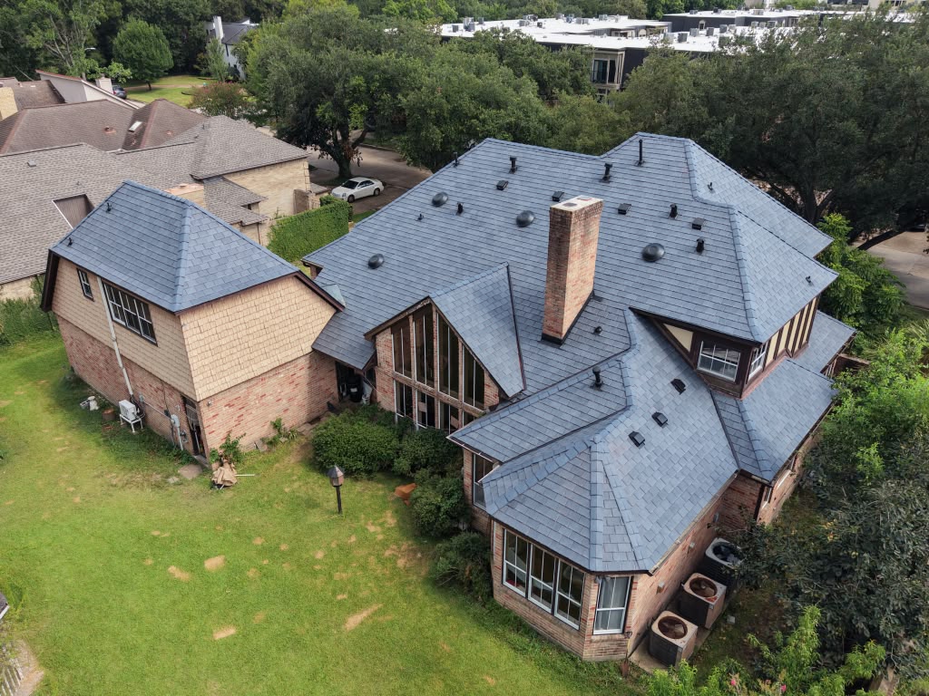 Completed residential roof replacement, aerial rear view